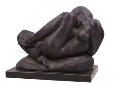 AN IRONWOOD CROUCHING NUDE CARVED FIGURE OF A RECLINING NUDE BY DERUJINSKY