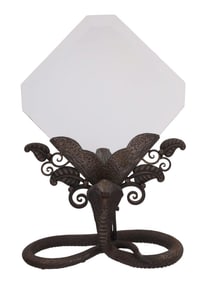 AN ART DECO HAND FORGED IRON FRAMED MIRROR WITH COBRA STAND