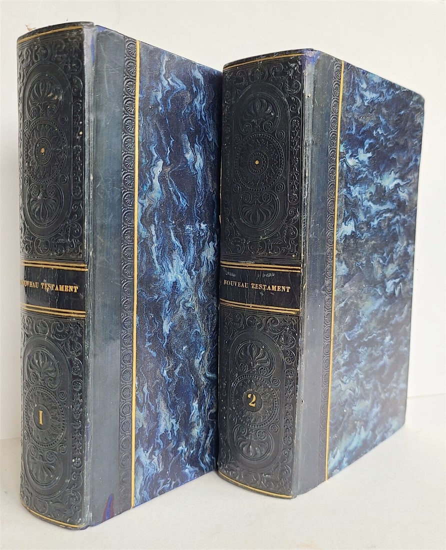 1793 BIBLE IN FRENCH ANTIQUE 2 VOLUMES ILLUSTRATED OVER 80 PLATES NEW TESTAMENT: Bible. Le Nouveau Testament... Traduit par Sacy. Paris: Didot, 1793 Over 80 engraved plates after Moreau le Jeune. 4 volumes bound in 2. Size 5 by 8 1/4" Original dark blue calf-backed boards decorate
