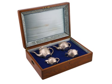 A 4-PIECE RUSSIAN TROMPE L?OEIL SILVER COFFEE AND TEA SET, 1886
