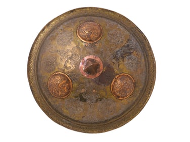 AN INDIAN BRASS DHAL SHIELD WITH A LARGE COPPER SPIKE, 19 C.