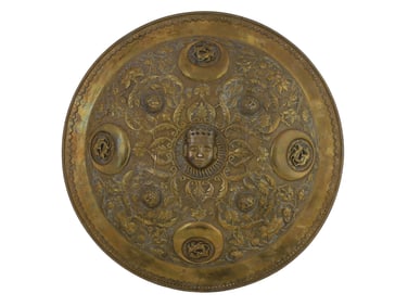 A GILT-HAMMERED COPPER INDIAN DHAL SHIELD, 19TH CENTURY