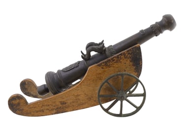 A CAST-BRONZE MODEL CANNON, DATED 1651