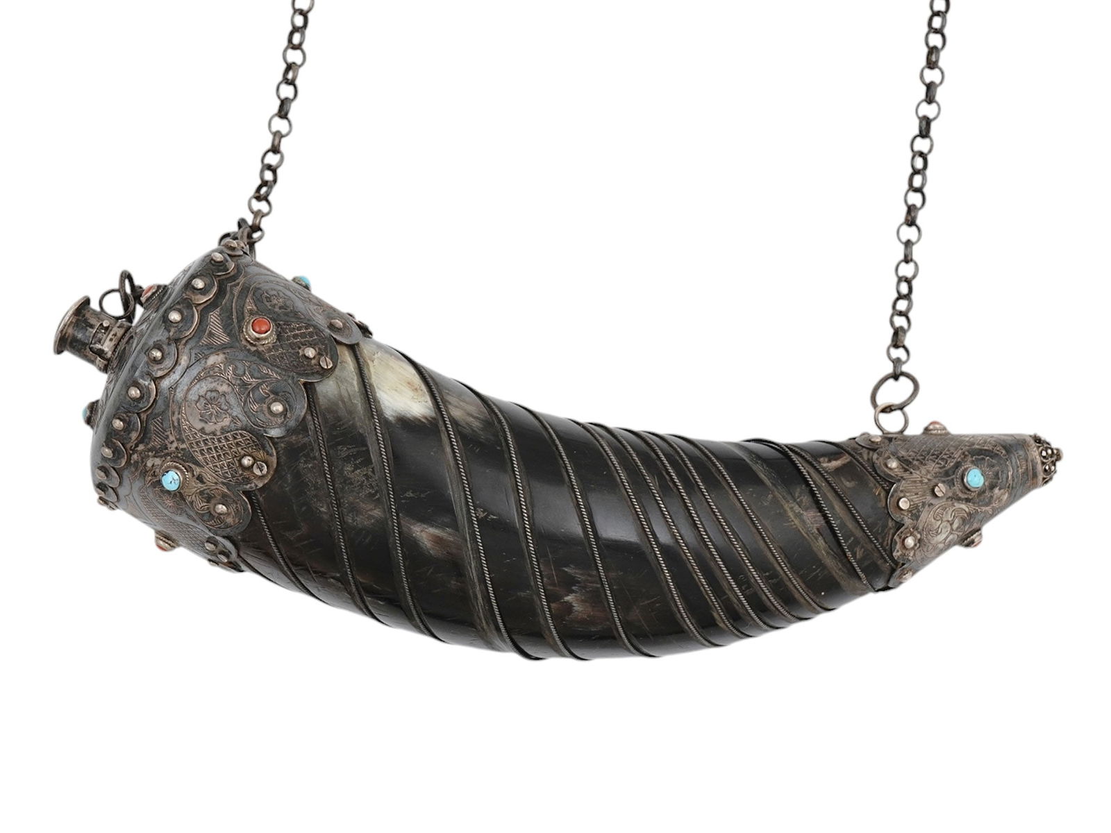 A LARGE OTTOMAN SILVER-MOUNTED HORN GUNPOWDER FLASK, 19TH CENTURY: With a tapering curved dark horn body, set on both sides with silver mounts engraved and embellished with niello floral motifs, set with turquoise and agate stones. Ottoman Empire, 19th century. Dimen