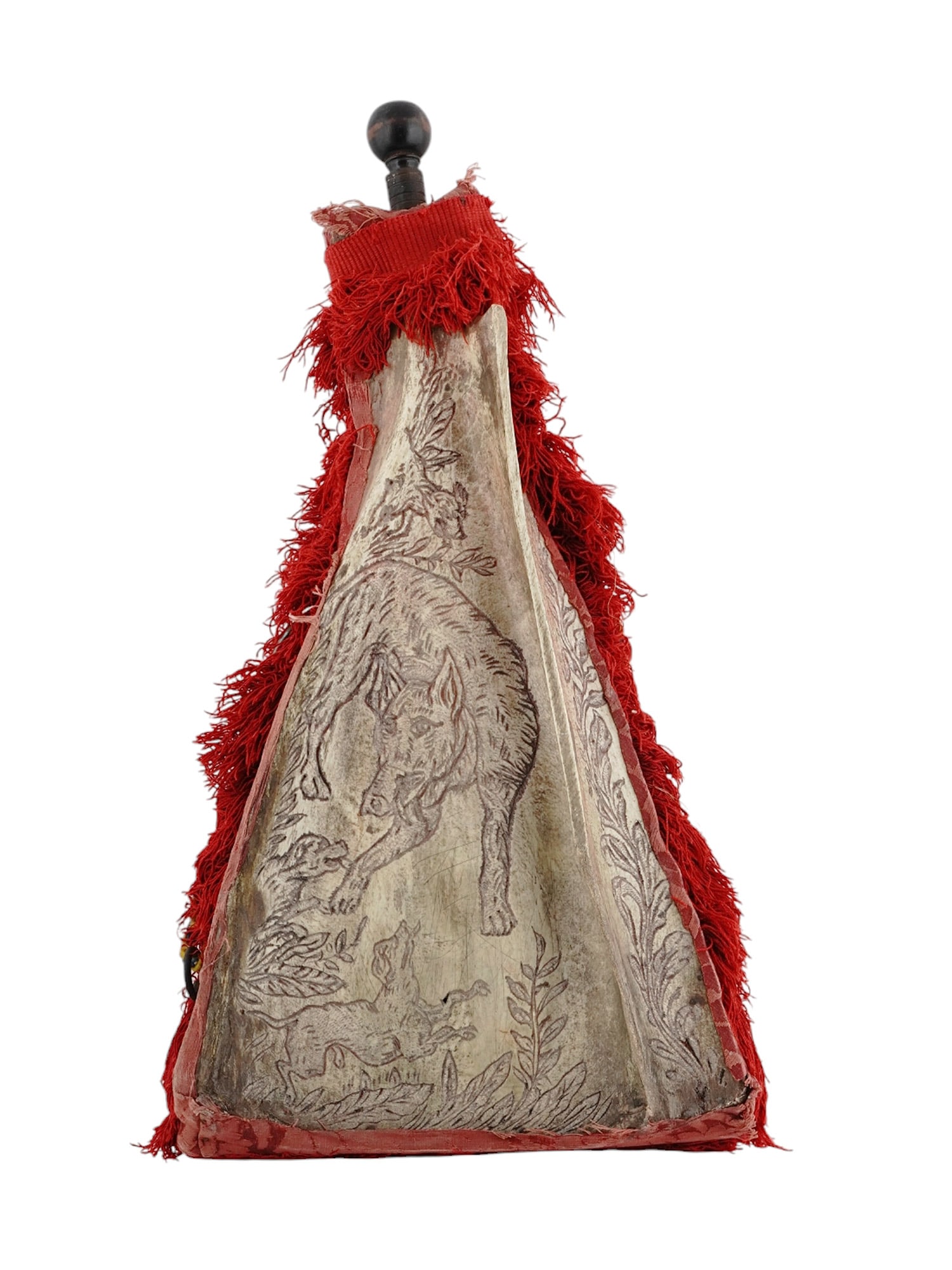 A VERY LARGE STAG BONE POWDER FLASK, CONTINENTAL EUROPE, 19TH CENTURY: A very large hunting powder flask made from the scapula (shoulder bone) of a stag, decorated with intricately engraved hunting scenes, one side with three hounds confronting a boar within a foliate bo