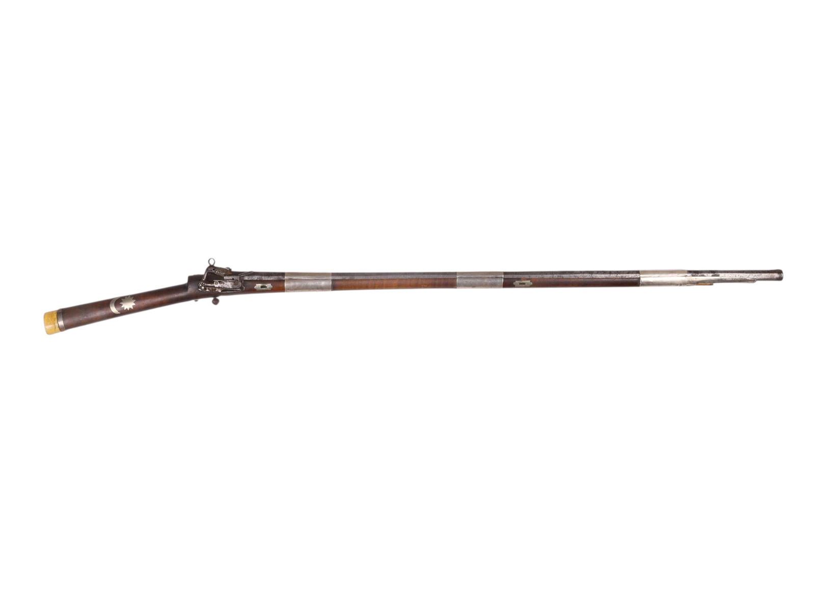 A CAUCASIAN SILVER-MOUNTED FLINTLOCK RIFLE, 19TH CEN.: Caucasian "Thopi" flintlock rifle. Miquelet lock. Silver-inlaid bone and wood stock. Button trigger. Punched Damascus barrel. Hallmarked silver fittings. Caucasus, 19th century. Dimensions: L: 48 1/8