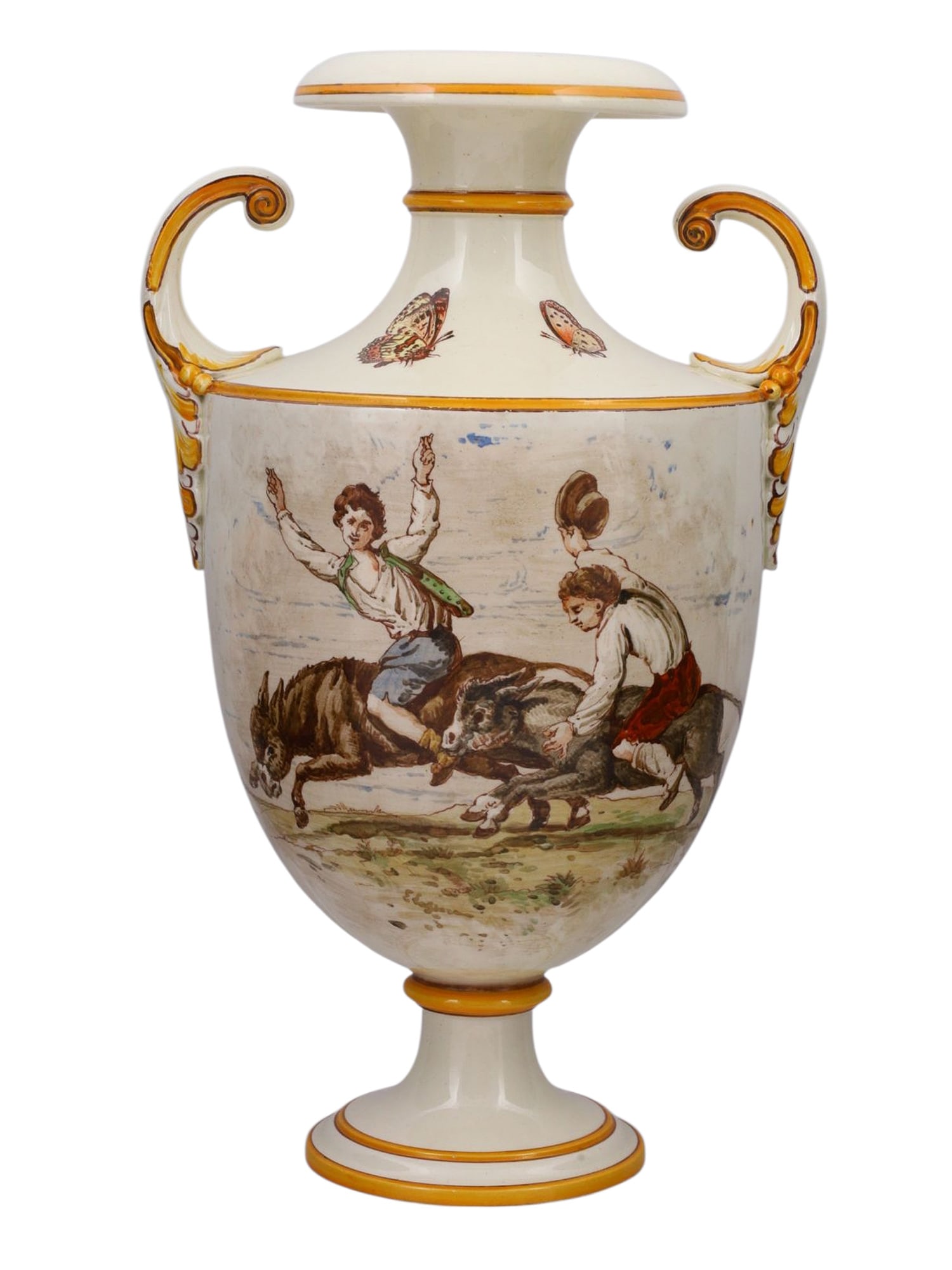 A WEDGWOOD PORCELAIN AMPHORA WITH PAINTED MULE RACE SCENE, 1887: A porcelain amphora style vase produced by the famous English firm Wedgwood in Staffordshire, showing a painted scene of two young men racing donkeys or mules through the countryside. The reverse side