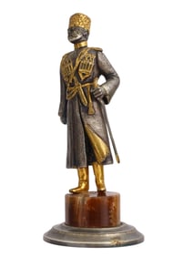 A SILVERED AND GILT BRONZE FIGURE OF A COSSACK ON A BROWN ONYX BASE, 19TH/20TH CEN.