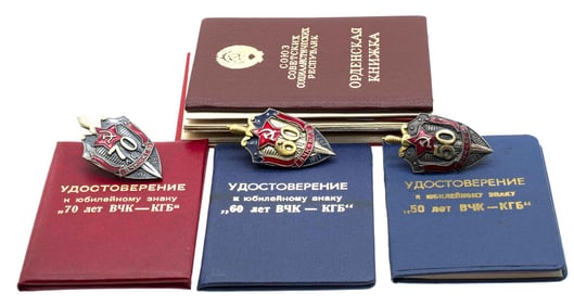 A COMPLETE SET OF THREE SOVIET ANNIVERSARY KGB BADGES WITH DOCUMENTS