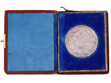 A CASED 1895 MUNICH LONG SERVICE TABLE MEDAL IN SILVER