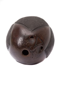 A CARVED COCONUT POWDER (PRIMING) FLASK, WEST COAST OF INDIA, 18TH C.