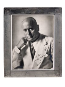 A SILVER-FRAMED PORTRAIT PHOTOGRAPH DEDICATED BY BENITO MUSSOLINI