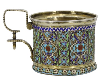 A RUSSIAN KHLEBNIKOV SILVER AND ENAMEL TEAGLASS HOLDER, 1877
