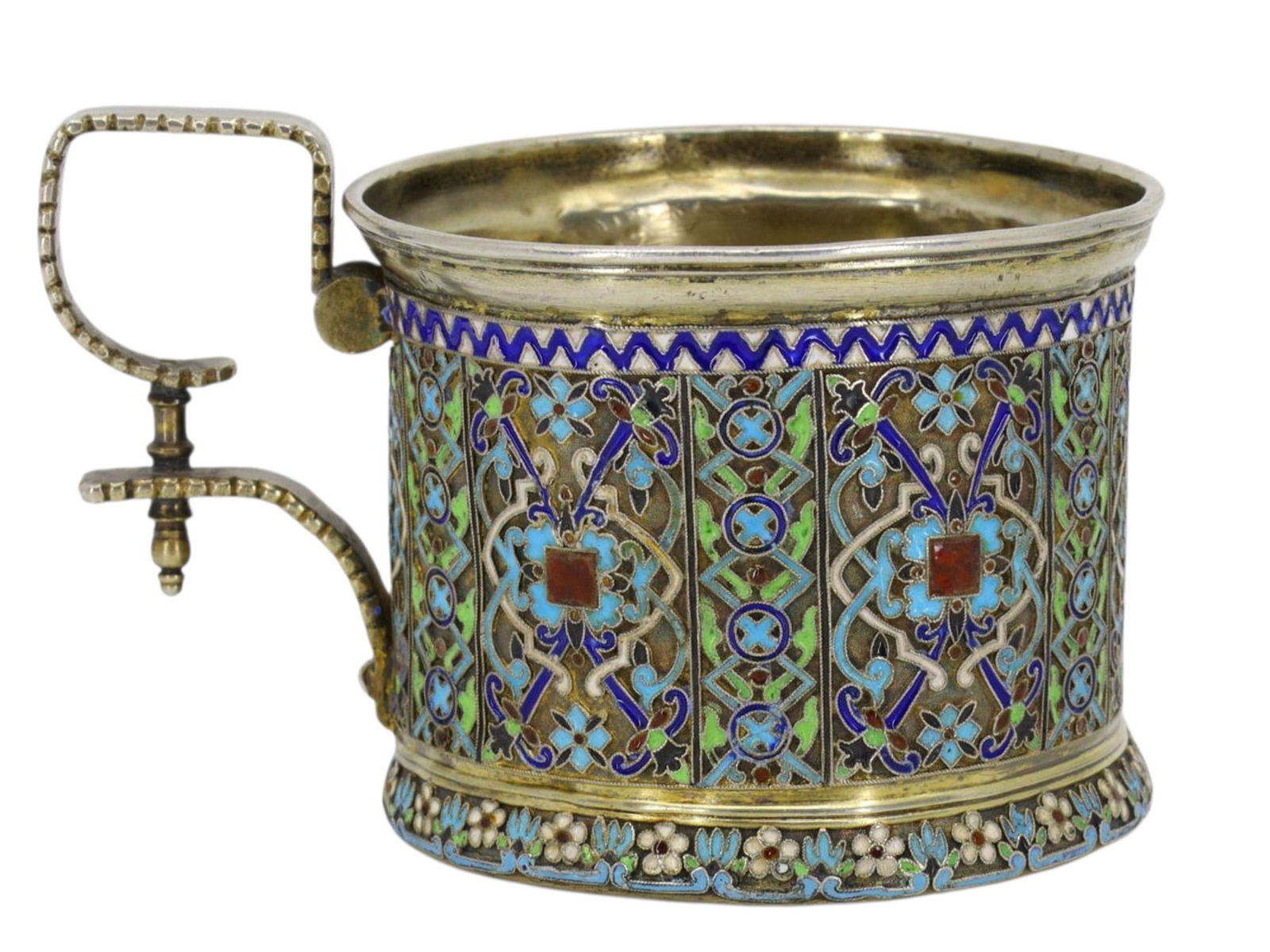 A RUSSIAN KHLEBNIKOV SILVER AND ENAMEL TEAGLASS HOLDER, 1877