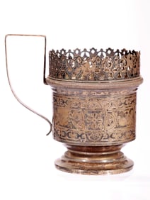 A RUSSIAN PAN-SLAVIC STYLE ENGRAVED SILVER TEA GLASS HOLDER
