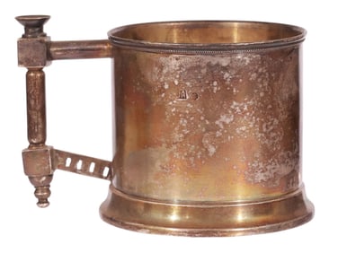 A RUSSIAN GILT-SILVER TEA GLASS HOLDER WITH PAN-SLAVIC STYLE HANDLE