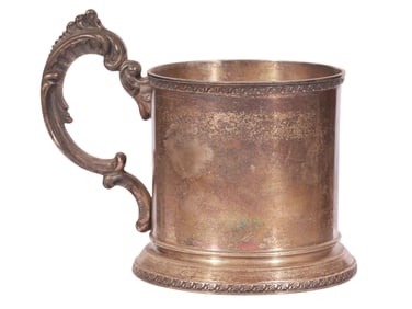 A RUSSIAN PARCEL-GILT SILVER TEA GLASS HOLDER