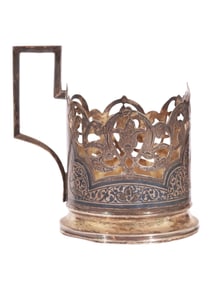 A RUSSIAN PARCEL-GILT SILVER AND NIELLO TEA GLASS HOLDER