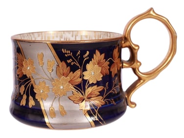 A RUSSIAN KORNILOV BROTHERS HAND-PAINTED GILT PORCELAIN TEA CUP