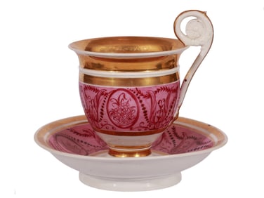 A LARGE RUSSIAN HAND-PAINTED AND GILT TEACUP AND SAUCER BY THE GARDNER FACTORY