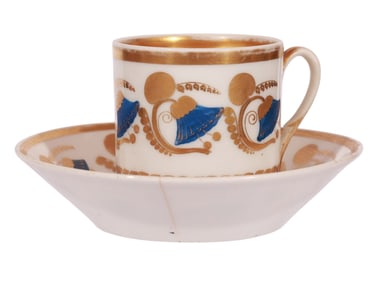 A RUSSIAN GILT-PAINTED PORCELAIN CUP AND SAUCER, CA. 1815 - 1830