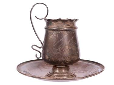 A RUSSIAN PARCEL-GILT SILVER ART NOUVEAU CUP AND SAUCER, C. 1890