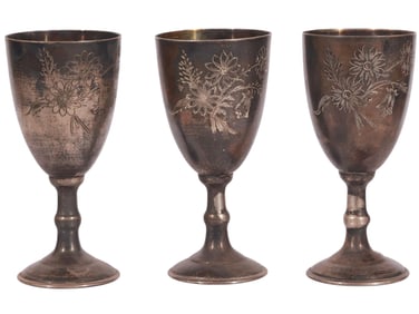 A SET OF 3 SMALL RUSSIAN PARCEL-GILT SILVER SHOT GLASSES