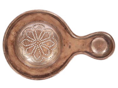A RUSSIAN SILVER TEA STRAINER BY MARIA SEMENOVA, 1899 - 1908