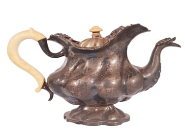 A RUSSIAN PARCEL-GILT SILVER TEAPOT WITH BONE ACCENTS