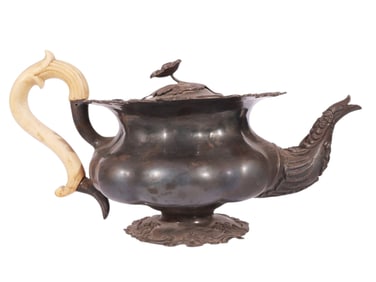 A RUSSIAN PARCEL-GILT SILVER TEAPOT WITH BONE HANDLE BY GUBKIN, 1844