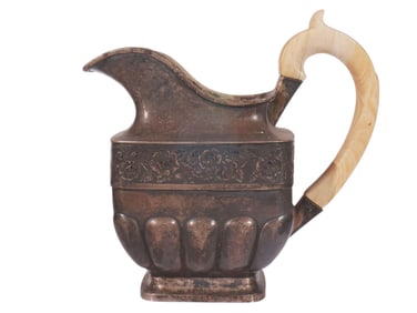 A RUSSIAN PARCEL-GILT SILVER CREAMER WITH BONE HANDLE, 1839