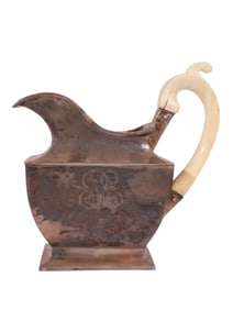 A RUSSIAN PARCEL-GILT SILVER CREAMER WITH BONE HANDLE