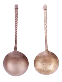 A LOT OF TWO RUSSIAN PARCEL-GILT SILVER SPOONS IN PAN-SLAVIC STYLE