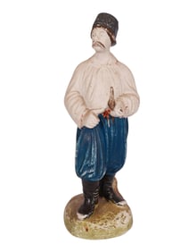 A RUSSIAN PRIVATE FACTORY BISQUE PORCELAIN FIGURE OF A UKRAINIAN COSSACK MAN