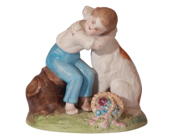 A SMALL GILT BISQUE PORCELAIN FIGURINE BY GARDNER OF A CHILD AND DOG