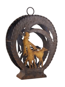 AN AMERICAN ART DECO WROUGHT IRON AND CUT IRON MAGAZINE RACK