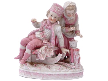 A GERMAN PORCELAIN FIGURINE GROUPING OF A BOY AND GIRL, CA. 1900