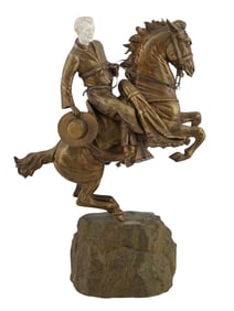 A LARGE GILT-BRONZE MOUNTED FIGURE WITH A CARVED FACE