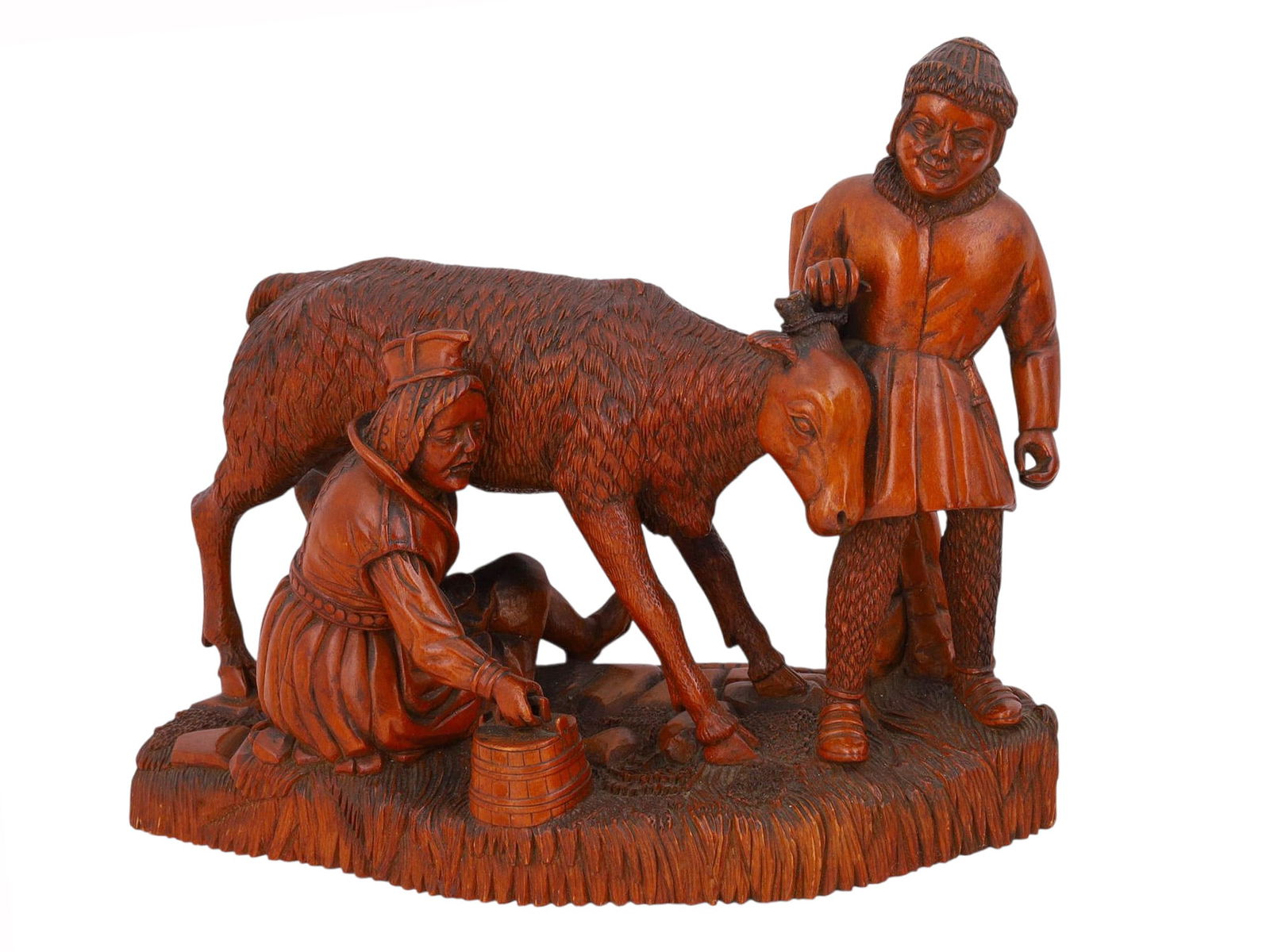 AN EARLY 20TH-CENTURY HAND-CARVED WOODEN GROUP FIGURE OF A SHEPHERD WITH A GOAT (1 of 3)