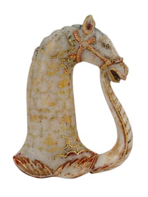 A PAINTED AND CARVED ALABASTER SWORD HILT, INDIA