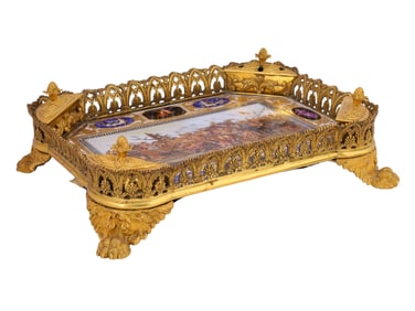 A GILT-BRONZE AND ENAMEL DESK STAND DEPICTING "ALEXANDER AND DARIUS AT GAUGAMELA"