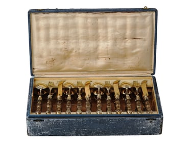 A CASED SET OF GERMAN GILT-SILVER UTENSILS, 18TH CEN.