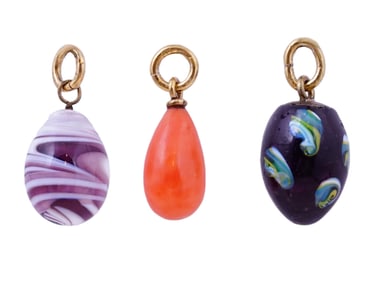 THREE RUSSIAN MINIATURE GOLD-MOUNTED ENAMEL EGG PENDANTS, 19TH CEN.