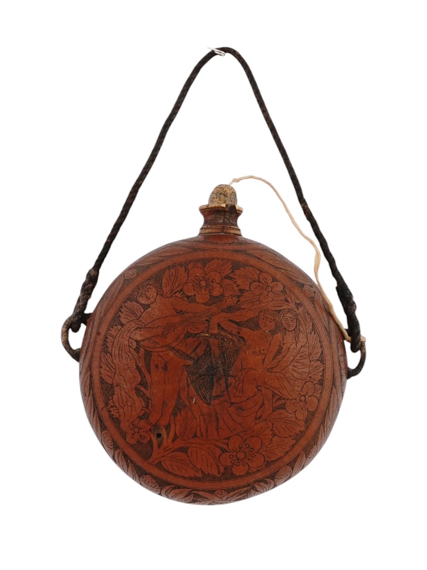 A EUROPEAN FINELY ENGRAVED POWDER HORN/PRIMING FLASK: The powder horn of a round form with flattened body entirely covered with engravings of a young man playing lute and a seated couple in front of him in a garden. The other side features a floral motif