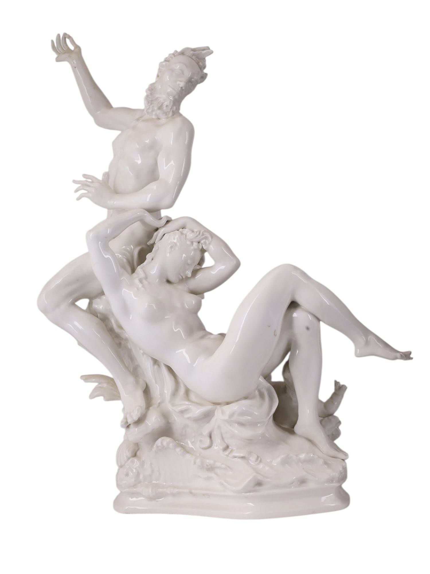 A PORCELAIN FIGURE GROUP OF A SATYR AND NYMPH WITH CUPID, KPM, FIRST HALF 20TH CENTURY: Porcelain figure group modeled in the round depicting a mythological scene with a standing satyr gesturing upward in animated contrapposto, his muscular nude form rendered with pronounced anatomical m