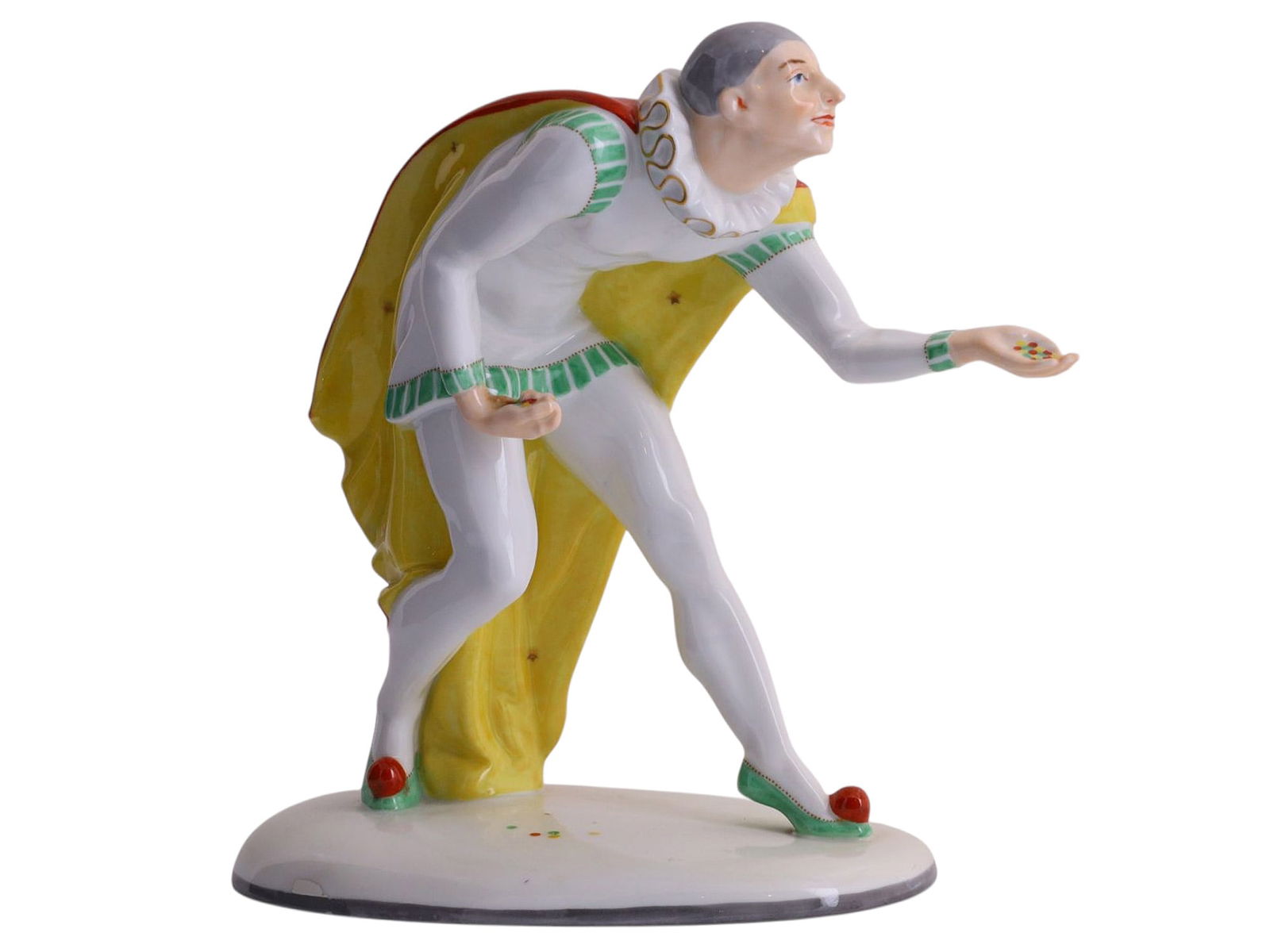 A PORCELAIN FIGURE OF A JESTER WITH CONFETTI, PIRKEN HAMMER, CZECHOSLOVAKIA, CIRCA 1930 (1 of 7)