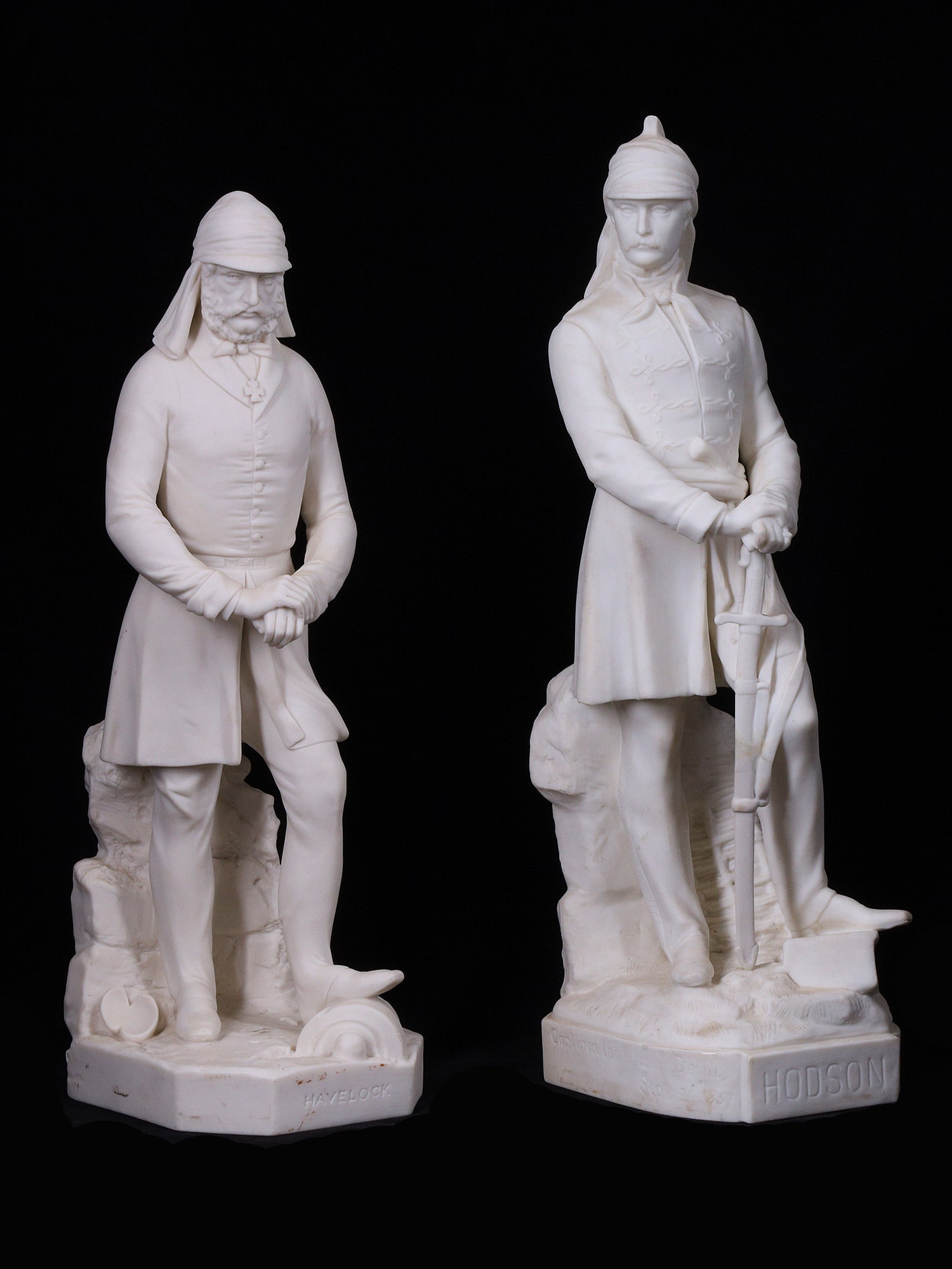 A PAIR OF VICTORIAN ENGLISH PARIAN WARE FIGURES, HODSON AND HAVELOCK, INDIA COLONIALISM: A pair of Victorian English Minton parian ware figures depicting two of the most important British Officers in Colonial India, Major-General Sir Henry Havelock and William Stephen Raikes Hodson, known