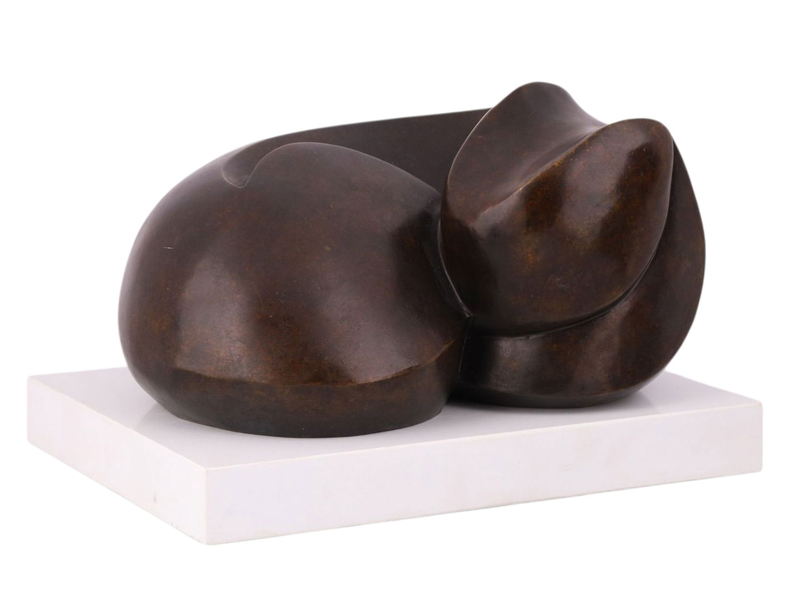 A BRONZE FIGURE OF A RECUMBENT CAT, SIGNED "C. HOTZ", 20TH CENTURY: Cast bronze sculpture modeled as a stylized recumbent cat, rendered in a compact, abstracted form with smoothly rounded volumes and minimal anatomical detail. The composition emphasizes mass and conto
