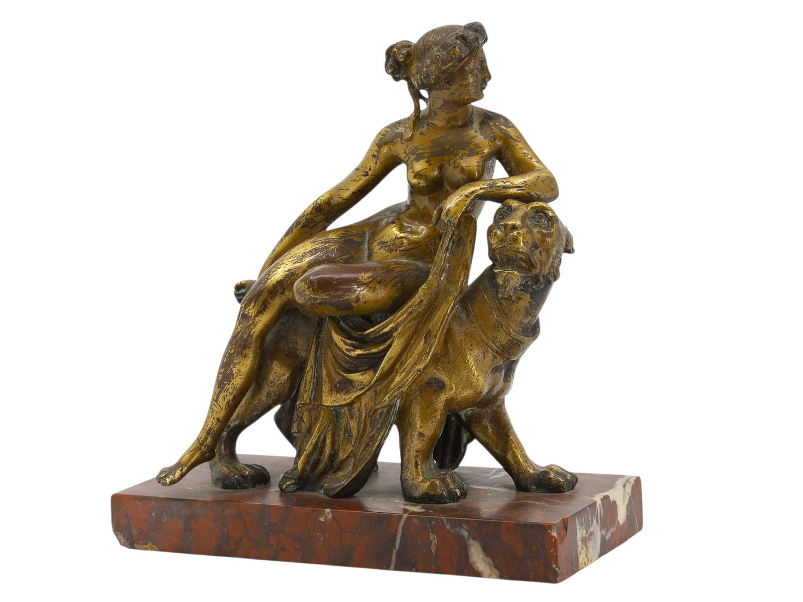 A GRAND TOUR BRONZE OF A WOMAN SEATED ON A LION, CONTINENTAL, LATE 19TH CENTURY: A Grand Tour–period bronze depicting a partially draped classical female figure seated side-saddle upon a lion. The woman is modeled nude to the waist, her head turned to the side, with one arm rest