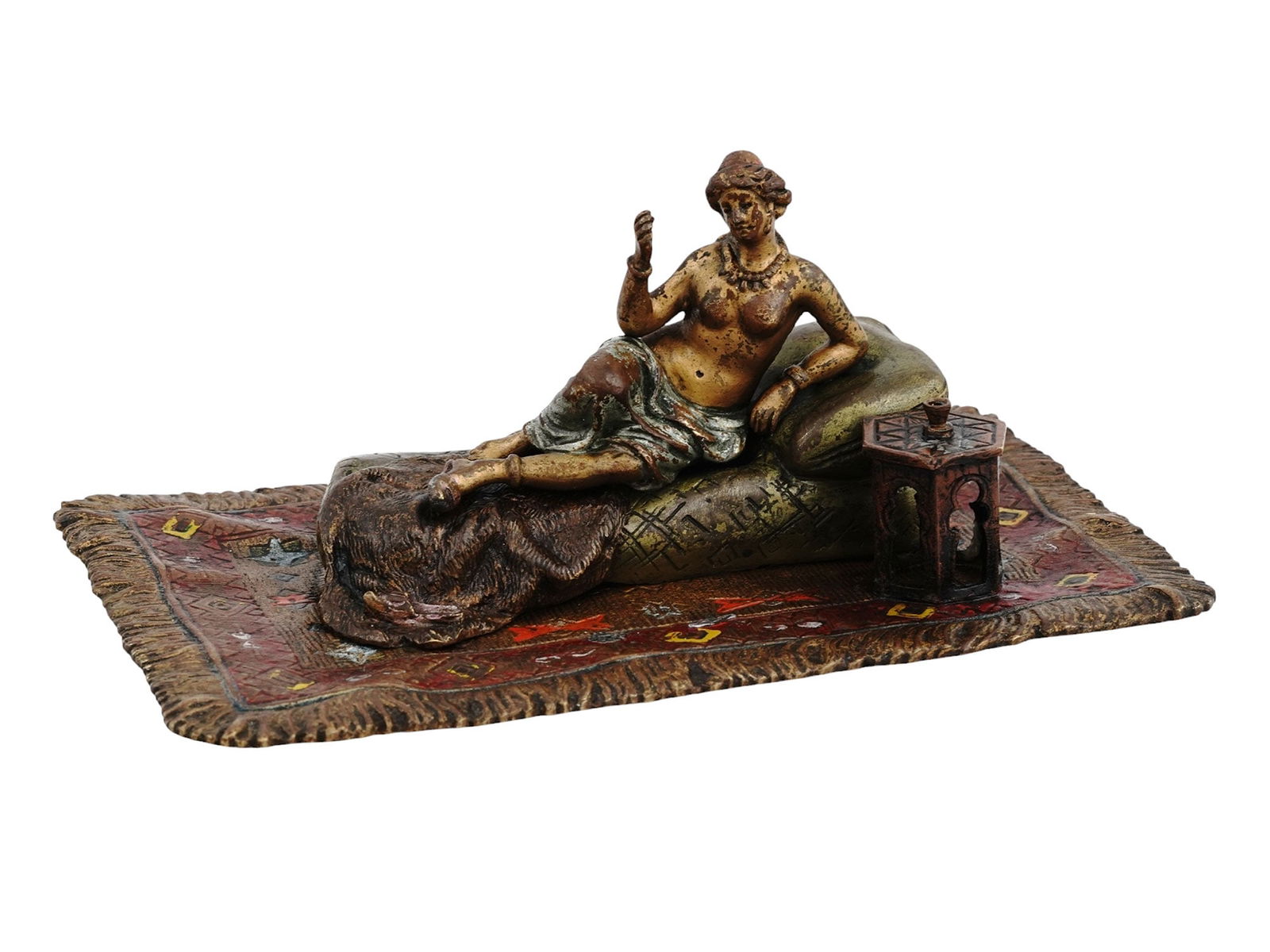 A RECLINING NUDE ODALISQUE, VIENNA BRONZE, FRANZ XAVIER BERGMANN, C. 1900: A reclining nude odalisque, or a woman of the harem, sat atop an Ottoman cushion covered with fine cloths and the skin of a lion. She wears little else but her elaborate jewelry. This piece is marked